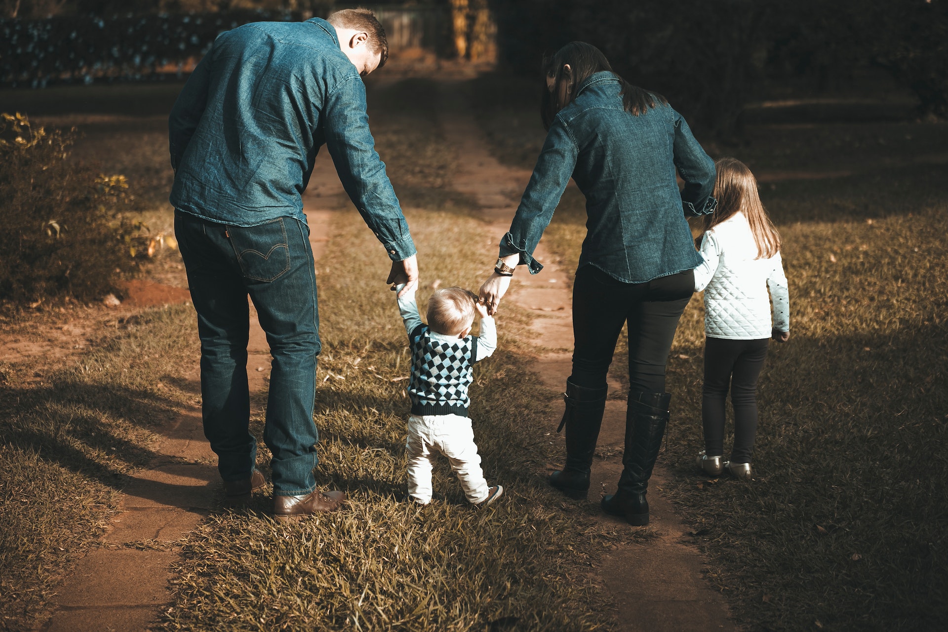 family walking on a trail