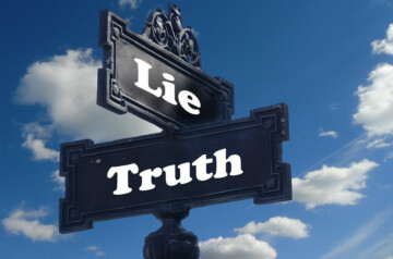 sign post with "Lie" and "Truth" on opposing directional signs